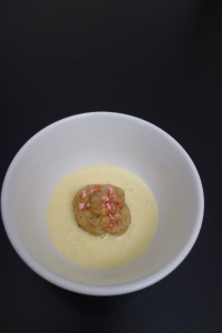 Sweet matzo ball in creme anglaise "soup"  topped with crushed candy cane